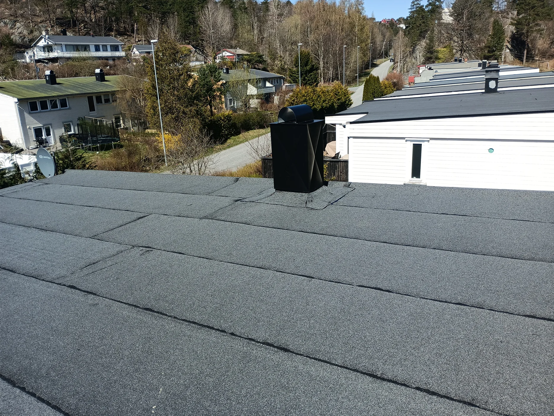 Completed residential roof shingle installation project