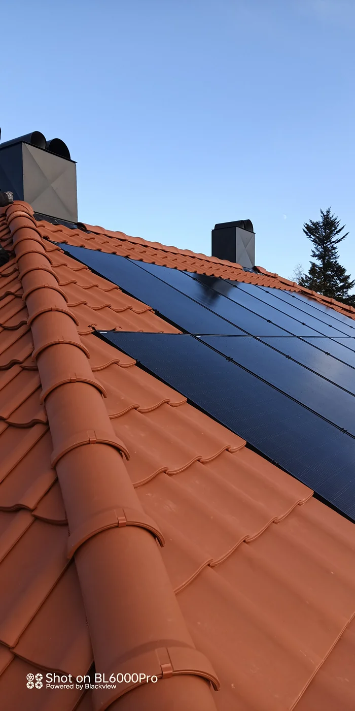 Solar panels installed on terracotta tile roof