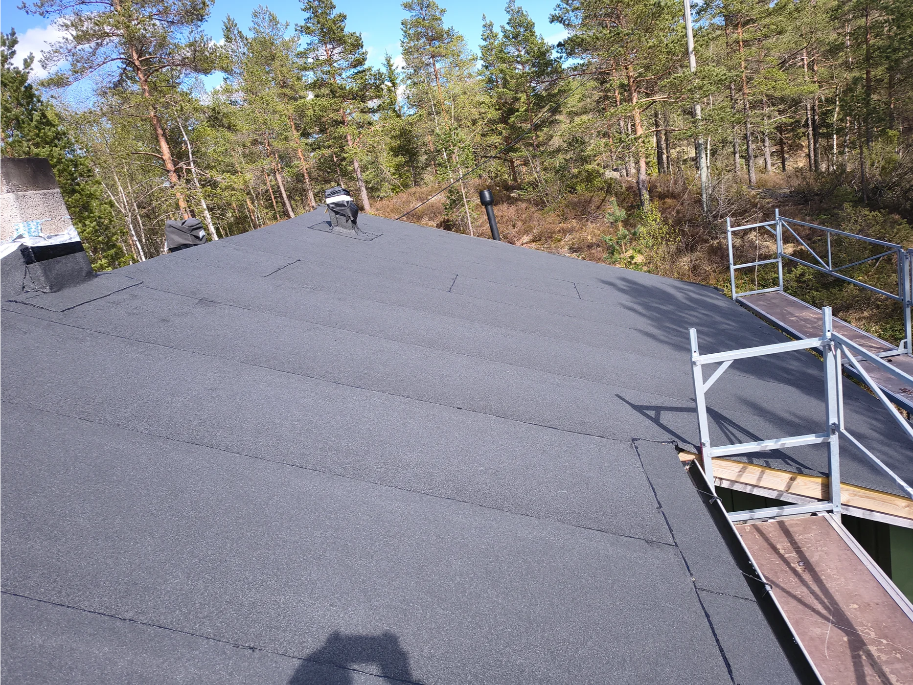 Finished flat roof with safety railings