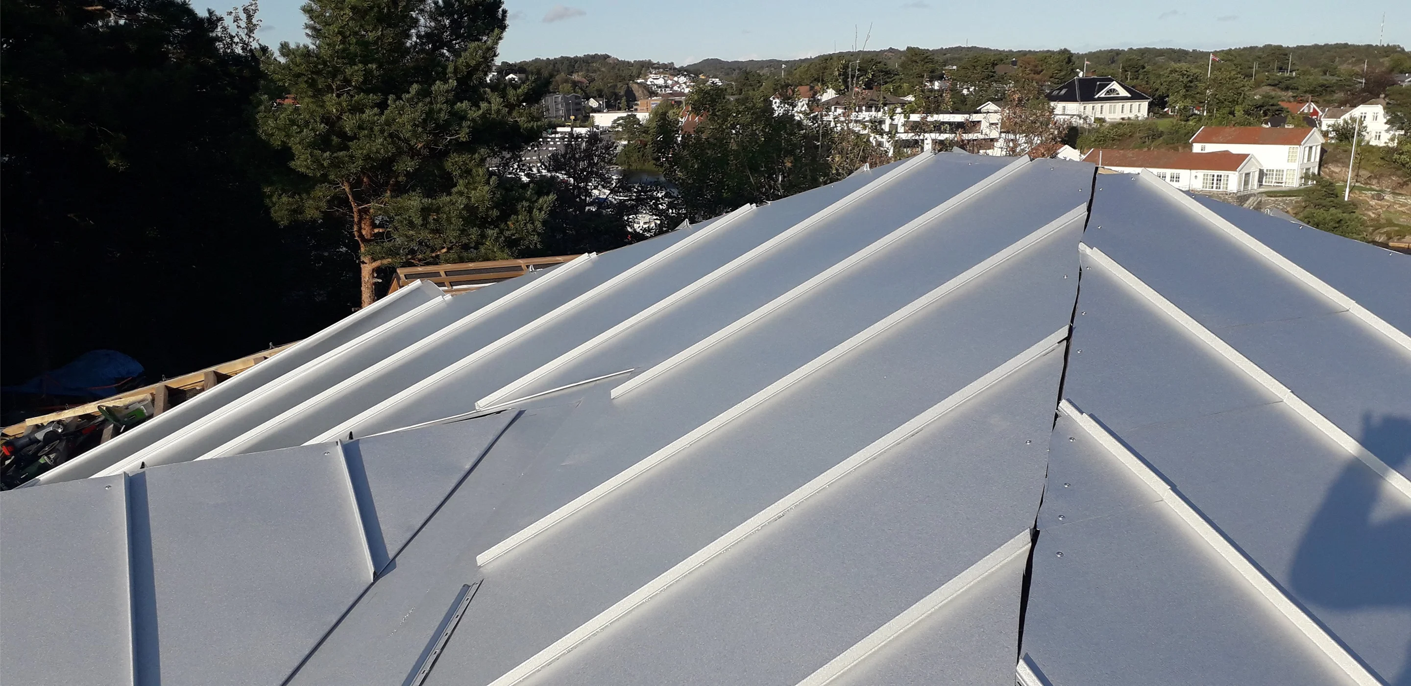 Modern white metal roof with ridges