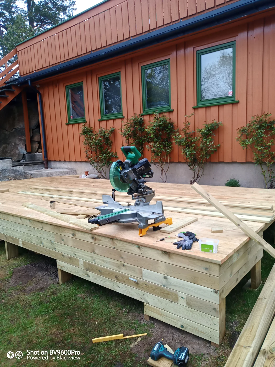 Modern home exterior with deck and renovation work