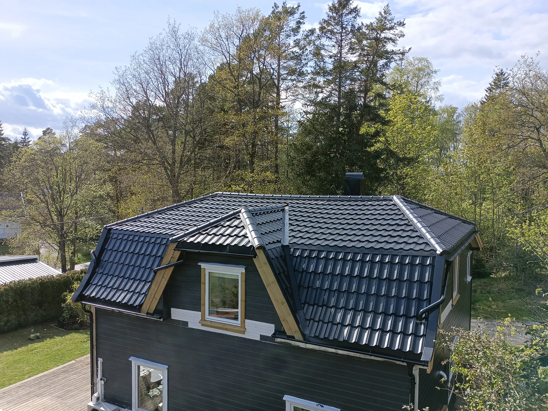 Modern black timber home with metal roof
