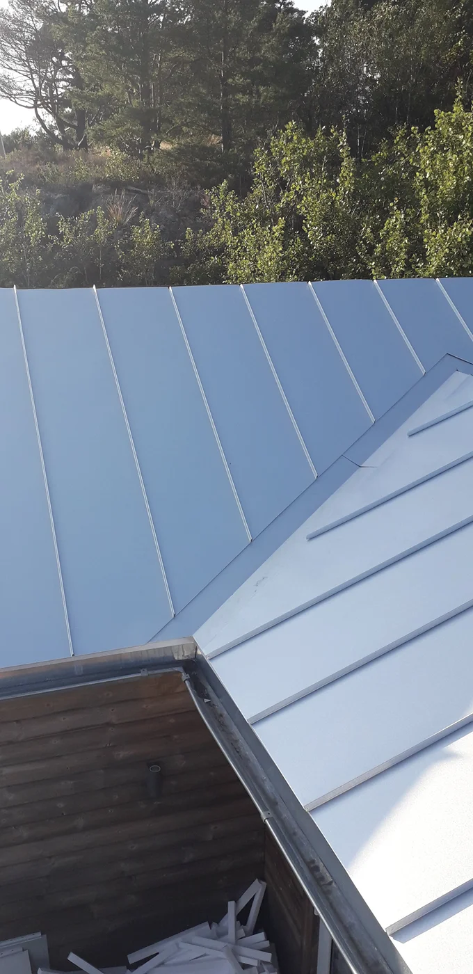 Modern standing seam metal roof installation
