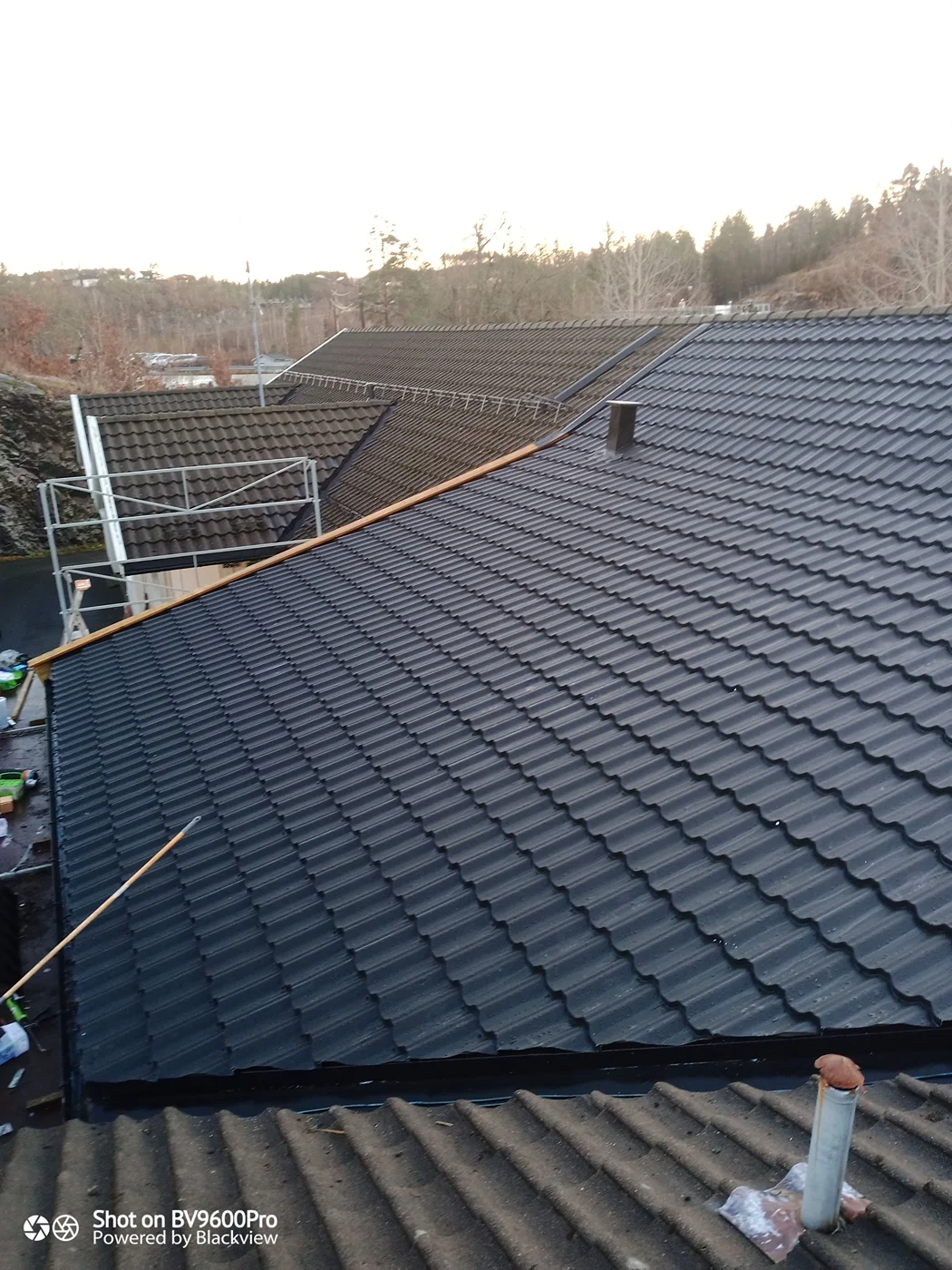 Solar panels installed on residential blue roof