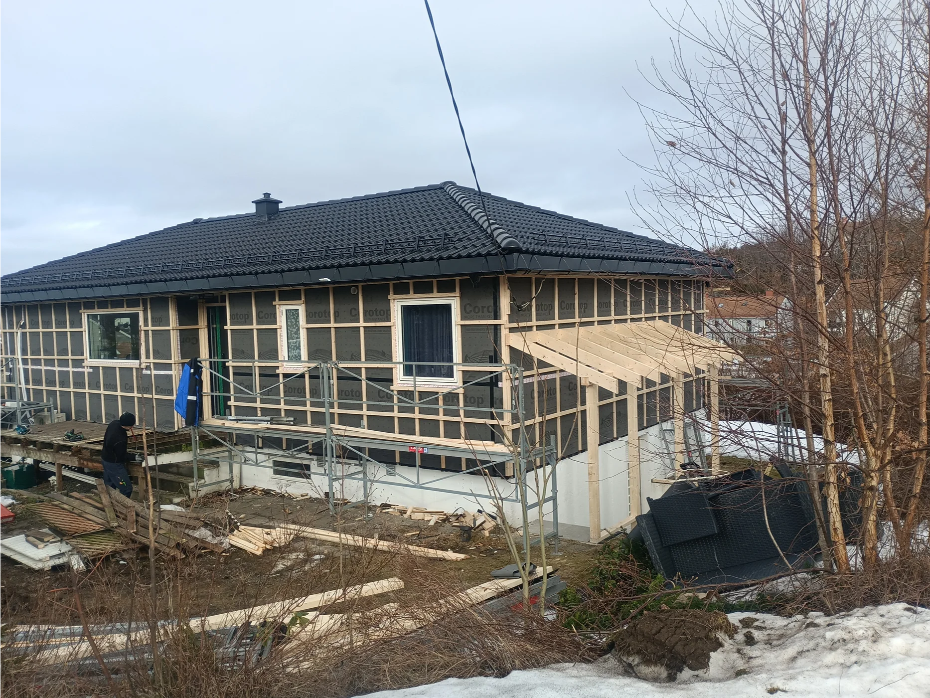 Modern home under construction with pitched roof