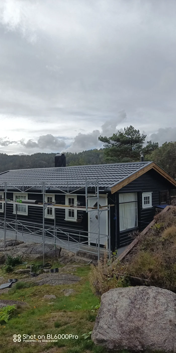 Modern hillside residence with metal roof