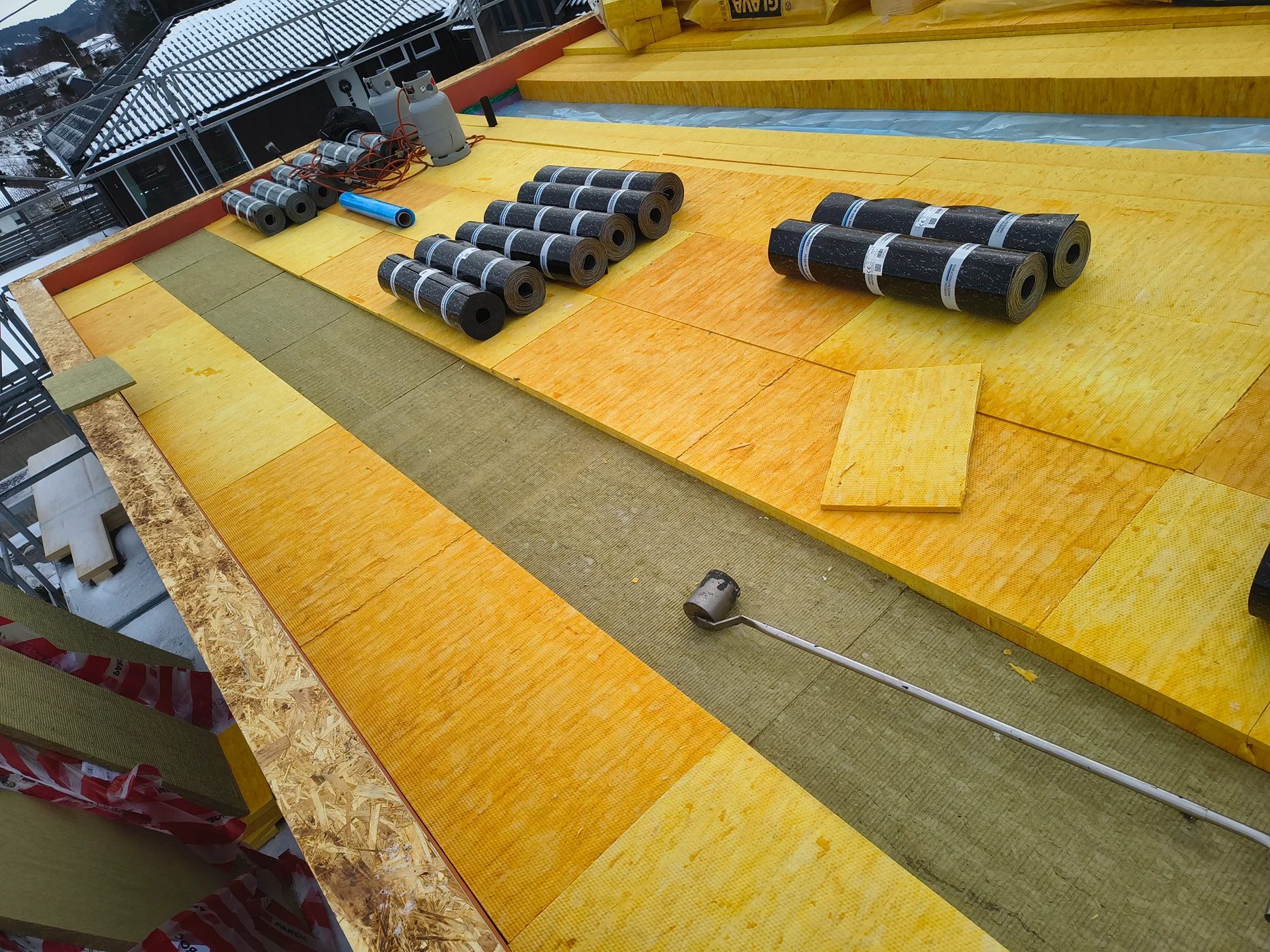 Roofing membrane installation on industrial surface